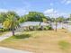 Inviting single-story home with lush landscaping and a well-kept lawn in a desirable neighborhood at 995 16Th St, Edgewater, FL 32132