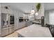 Well-appointed kitchen featuring gray cabinets, stainless steel appliances, and quartz countertops at 995 16Th St, Edgewater, FL 32132