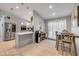 Open concept kitchen with gray cabinets, stainless steel appliances, and eat-in breakfast nook at 995 16Th St, Edgewater, FL 32132