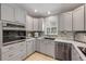 Bright kitchen featuring gray cabinets, stainless steel appliances, and a tiled backsplash at 995 16Th St, Edgewater, FL 32132