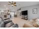 Spacious living room with tile flooring, ceiling fan, and a comfortable seating arrangement at 995 16Th St, Edgewater, FL 32132
