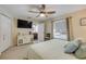 Bright main bedroom featuring a ceiling fan, double closets, and en suite bath at 995 16Th St, Edgewater, FL 32132