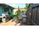 Outdoor grilling area and shower, surrounded by well-maintained landscaping at 114 Hickory St, New Smyrna Beach, FL 32168