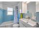 Compact bathroom with a bathtub, toilet, and single sink vanity at 114 Hickory St, New Smyrna Beach, FL 32168