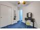 This room features blue carpet with a vanity and ensuite, complete with a walk in closet at 114 Hickory St, New Smyrna Beach, FL 32168