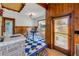 Dining area with wood accents, natural light, and checkered flooring at 114 Hickory St, New Smyrna Beach, FL 32168