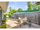 Open patio with outdoor table, chairs, and a barbecue grill, great for entertaining at 114 Hickory St, New Smyrna Beach, FL 32168