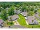 Drone image featuring the residential homes with lush landscaping and community pool in Hawks Landing at 115 Bob White Ct, Daytona Beach, FL 32119