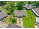 Aerial view showcasing the home's roof, driveway, and well-maintained landscaping at 115 Bob White Ct, Daytona Beach, FL 32119