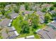 Aerial view highlighting the community layout, mature trees, and residential homes at 115 Bob White Ct, Daytona Beach, FL 32119