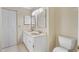 Bright bathroom featuring a double sink vanity and ample lighting at 115 Bob White Ct, Daytona Beach, FL 32119