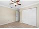 Neutral bedroom with closet and ceiling fan at 115 Bob White Ct, Daytona Beach, FL 32119