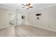 Bedroom with tile floors leading to bathroom and kitchen at 115 Bob White Ct, Daytona Beach, FL 32119