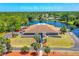 Aerial view of the Pelican Bay Country Club overlooking a scenic waterfront and lush greenery at 115 Bob White Ct, Daytona Beach, FL 32119