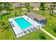 Community swimming pool featuring lounge chairs, a gazebo, and a secure gated perimeter at 115 Bob White Ct, Daytona Beach, FL 32119