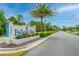 Entrance to East Pelican Bay Golf Community with well-maintained landscaping and a welcoming sign at 115 Bob White Ct, Daytona Beach, FL 32119