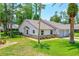 Charming single-story home featuring a well-maintained lawn, brick accents, and an attached single-car garage at 115 Bob White Ct, Daytona Beach, FL 32119
