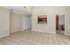 Open living space features tile floors, a view into the kitchen, and plenty of natural light at 115 Bob White Ct, Daytona Beach, FL 32119