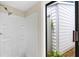 Walk-in shower with a view of the exterior at 115 Bob White Ct, Daytona Beach, FL 32119