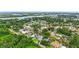 Expansive aerial showcasing the home's landscaping and canal front location in a charming community at 128 Godfrey Rd, Edgewater, FL 32141