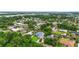 Serene aerial of homes nestled within lush trees and the extensive canals of the waterfront community at 128 Godfrey Rd, Edgewater, FL 32141