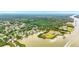 Beautiful aerial view of waterfront homes on a river with lush green surroundings at 128 Godfrey Rd, Edgewater, FL 32141