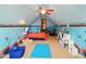 Playful bedroom with themed decor, a vaulted ceiling, and neutral colored carpet at 128 Godfrey Rd, Edgewater, FL 32141