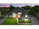 Gorgeous two-story home with landscaped front yard, gray brick accents and a inviting entryway at 128 Godfrey Rd, Edgewater, FL 32141