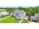 Beautiful home featuring lush landscaping, a gray roof, and a spacious driveway at 128 Godfrey Rd, Edgewater, FL 32141