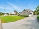 Charming two-story home with an attached garage and a spacious lawn at 128 Godfrey Rd, Edgewater, FL 32141