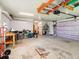 Large garage providing plenty of storage and workspace, also features overhead storage solutions at 128 Godfrey Rd, Edgewater, FL 32141