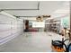 Spacious garage with ample storage, shelving, and work area; perfect for projects and organization at 128 Godfrey Rd, Edgewater, FL 32141