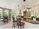 Modern kitchen with sleek countertops, breakfast bar, and stainless steel appliances at 128 Godfrey Rd, Edgewater, FL 32141