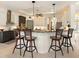 Spacious kitchen with granite countertops, breakfast bar seating and modern stainless appliances at 128 Godfrey Rd, Edgewater, FL 32141