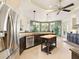 A spacious kitchen featuring stainless steel appliances, dark cabinets, and a bright, airy feel at 128 Godfrey Rd, Edgewater, FL 32141