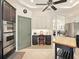 Bright eat-in kitchen features stainless appliances, ceiling fan, desk area and access to the dining room at 128 Godfrey Rd, Edgewater, FL 32141