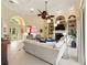 Open-concept living room with fireplace, built-in shelving, and neutral decor at 128 Godfrey Rd, Edgewater, FL 32141