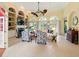 Beautiful living room featuring high ceilings, a fireplace, and large arched windows at 128 Godfrey Rd, Edgewater, FL 32141