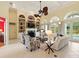 Spacious living room boasting a fireplace, comfortable furniture, and a view of the pool at 128 Godfrey Rd, Edgewater, FL 32141