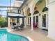 Inviting outdoor pool area with covered seating, perfect for relaxation and entertaining at 128 Godfrey Rd, Edgewater, FL 32141