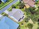 Aerial view of a single-Gathering home with a well-maintained lawn and mature landscaping at 1307 Wayne Ave, New Smyrna Beach, FL 32168