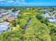 A broad aerial view of a suburban community, highlighting the lush nature and peaceful setting at 1307 Wayne Ave, New Smyrna Beach, FL 32168