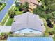Aerial view of home showing roof, landscaping and a quiet suburban street at 1307 Wayne Ave, New Smyrna Beach, FL 32168