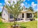 Beautiful backyard showcases a cozy patio area, mature trees, and well-maintained landscaping at 1307 Wayne Ave, New Smyrna Beach, FL 32168
