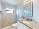 Bathroom featuring a shower, granite countertops, and a sink at 1307 Wayne Ave, New Smyrna Beach, FL 32168