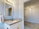 Bathroom featuring granite countertops, a sink, and a mirror at 1307 Wayne Ave, New Smyrna Beach, FL 32168