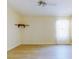 Bedroom with a shelf on the wall and natural light from the window at 1307 Wayne Ave, New Smyrna Beach, FL 32168