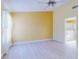 Bedroom with en-suite bathroom, ceiling fan, and a window with natural light at 1307 Wayne Ave, New Smyrna Beach, FL 32168