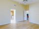 Bedroom with a ceiling fan and ensuite bath and view into living room at 1307 Wayne Ave, New Smyrna Beach, FL 32168