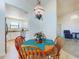 Dining room with decorative chandelier and natural light, leads to the kitchen and living room at 1307 Wayne Ave, New Smyrna Beach, FL 32168